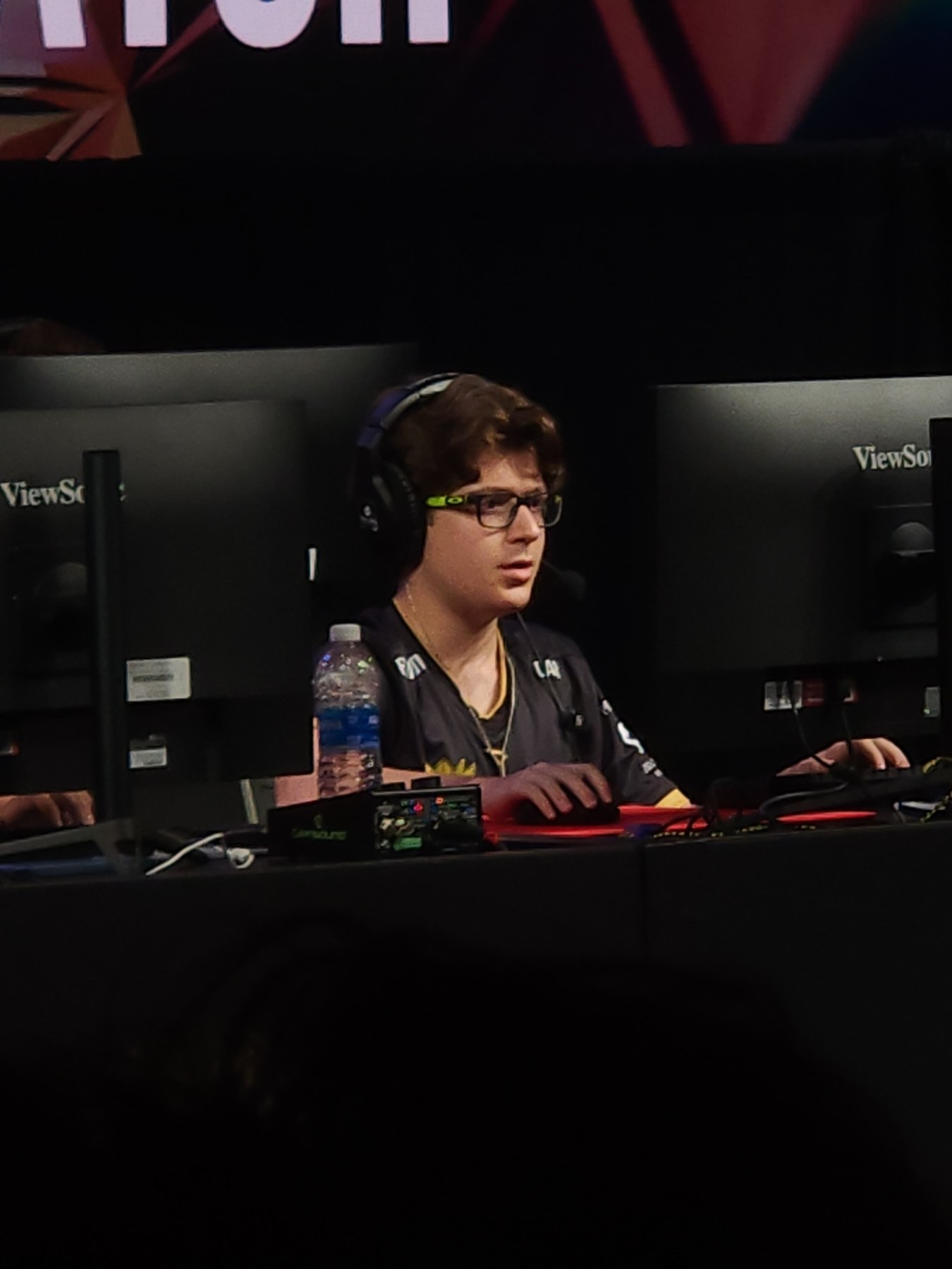 Focused STORM player competing at a monitor during a live event