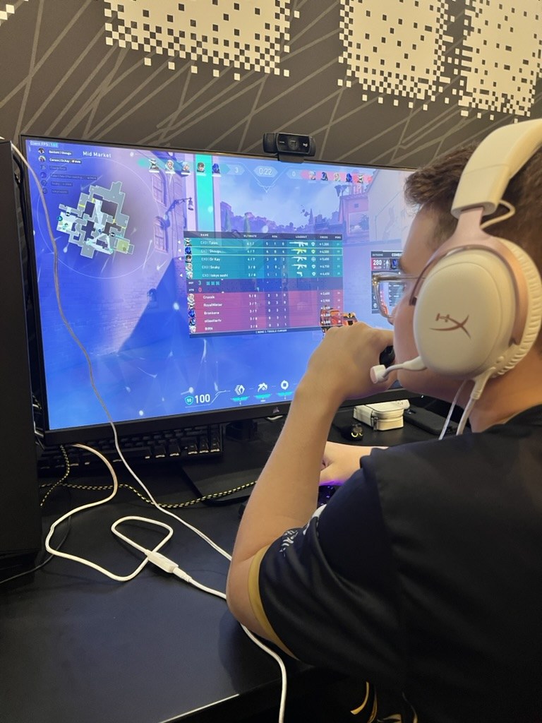 Close-up of a STORM player competing with a headset on during tournament play