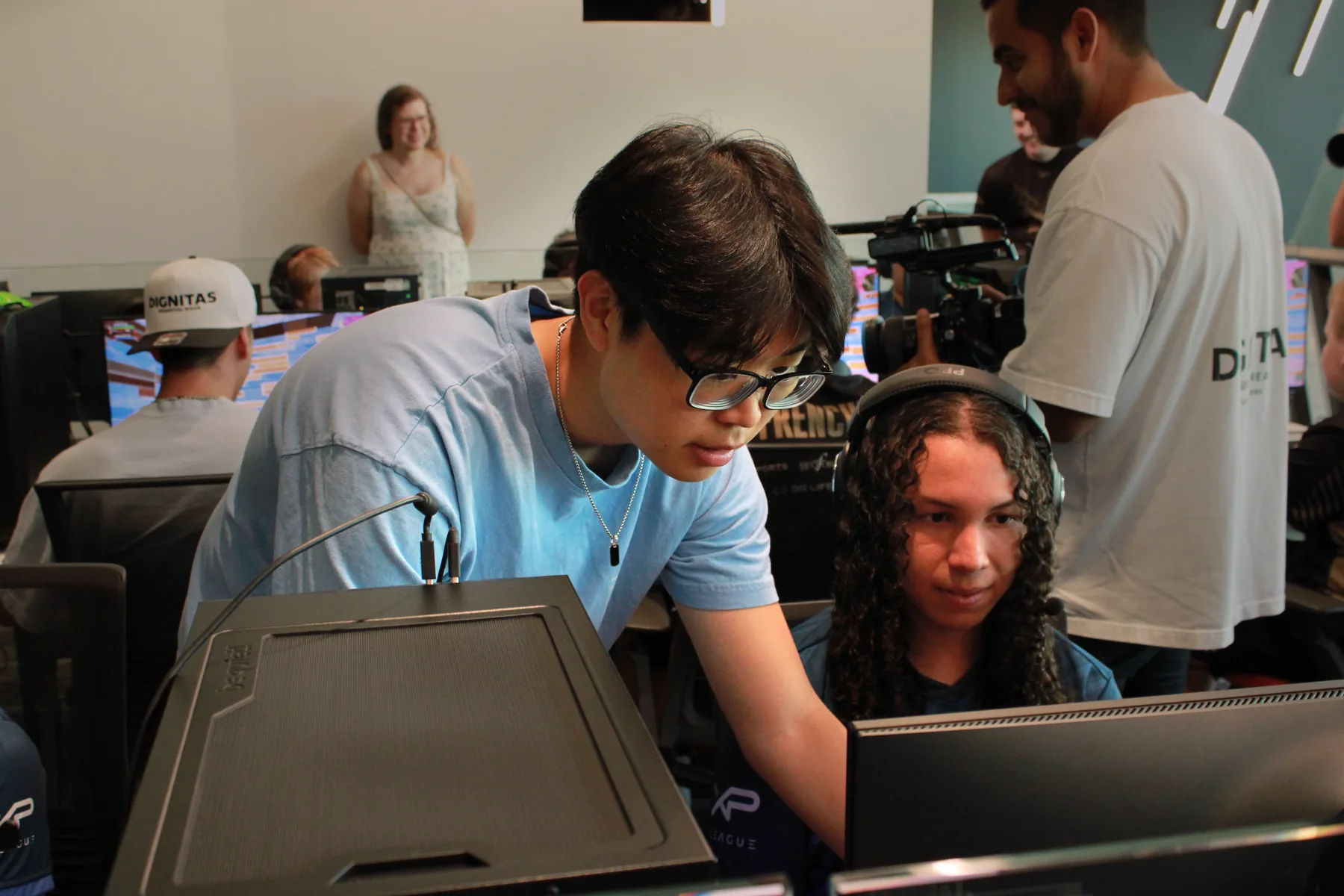 Youth esports players collaborating and learning during a professional Fortnite opportunity